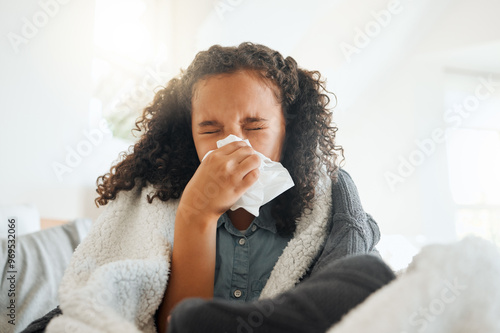 Little girl, sick and blowing nose with tissue for virus, cold or flu from allergy, symptoms or infection at home. Female person, child or kid with blanket for influenza, sneeze or fever from sinus