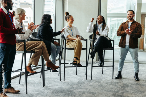 Diverse group of professionals talking and engaging in a business conference event