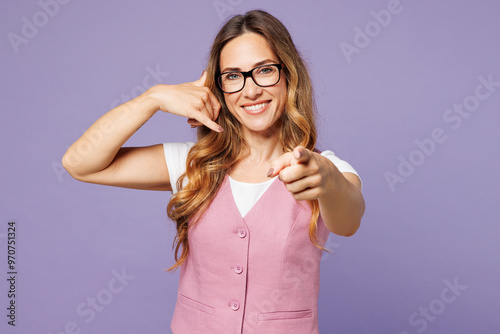 Young happy fun successful employee business woman corporate lawyer wear white t-shirt vest glasses doing phone gesture like says call me back isolated on plain pastel light purple background studio.