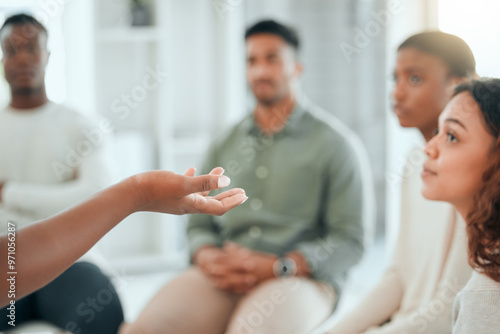 Talking, hands and group of people in therapy for mental health support, sharing story or recovery. Counseling, listen or rehabilitation for trauma, addiction and meeting for wellness, advice or help