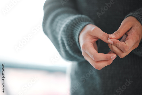 Hands, anxiety and person in counseling for therapy, trauma or mental health in psychologist office. Woman, fidgeting or PTSD in session for depression, paranoia or memory at consultation for healing