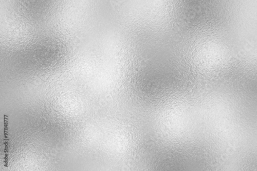 Silver foil with frosted glass texture, shiny and glossy glitter background for fabric, surface, pattern, print art design.