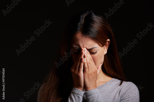 Sad woman, crying and emotional pain with mockup space for abuse, mental illness or disorder in studio on a black background. Female person, model or psychosis with anxiety, depression or stress