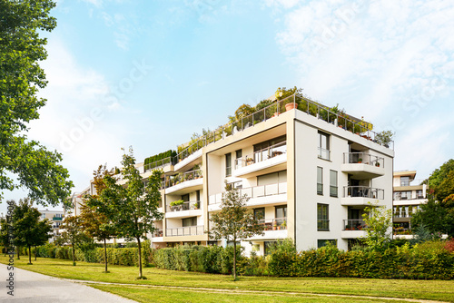 Residential area with ecological and sustainable green residential buildings, low-energy houses with apartments and green courtyard