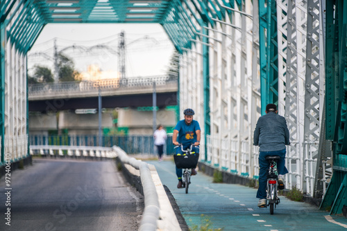 Cyclists Riding on Puente de Hierro Sevilla in Andalusia Spain