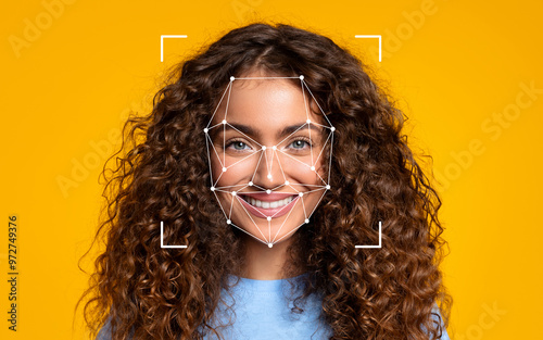 A woman with curly hair smiles brightly as a facial recognition overlay appears on her face against a vibrant yellow background.