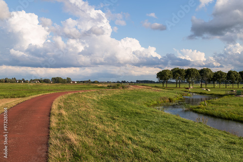 Cycle path through the rural polder area of ​​Eemland in the Netherlands.