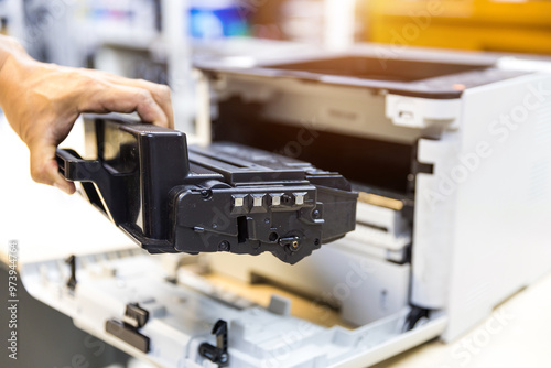 Technician replace ink cartridges of printer toner low and fix repair problem paper or print scanning fax or copy document or photocopier or photocopy office workplace equipment concept