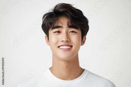 Portrait of happy smart and handsome young Asian man on white background. Studio shot, copy space