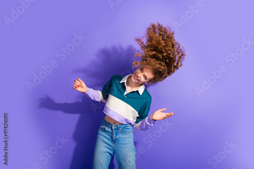 Photo of nice charming young girl dance flying hair isolated on violet color background