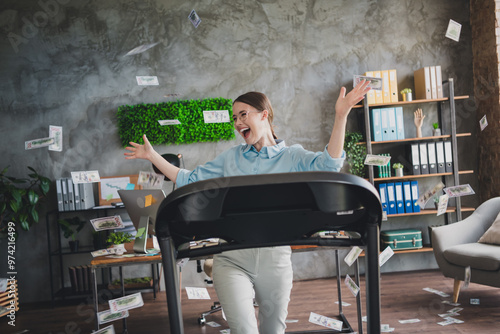 Photo of sweet funny lady assistant wear shirt flying dollars running treadmill indoors workplace workstation