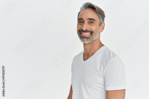 Happy middle aged 45 years old man isolated on white studio background. Confident mature handsome bearded gray-haired male model wearing t-shirt looking at camera. Portrait. Copy space.