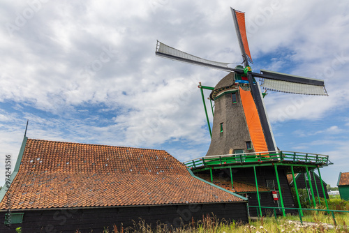 Dutch windmill and farmhouse in the touristic village Zaanse Schans in Zaandijk, Netherlands