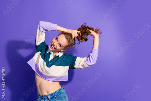 Photo of nice charming young girl arms hold hair empty space isolated on violet color background