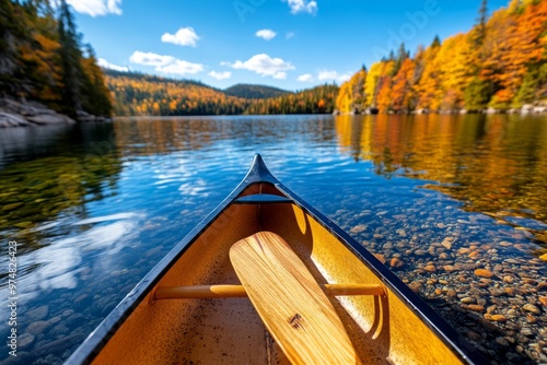 Autumn Canoeing in Canada visualized in a travel guide, highlighting iconic canoe routes through colorful landscapes like Algonquin Park and the Bowron Lakes