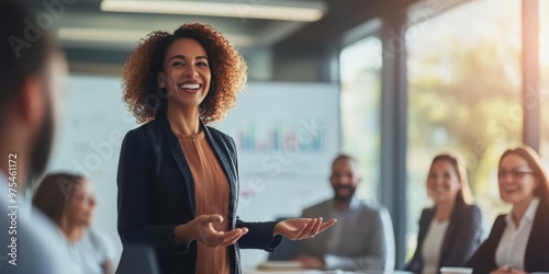 A confident presenter engaging an audience in a modern office setting, showcasing leadership and effective communication skills.