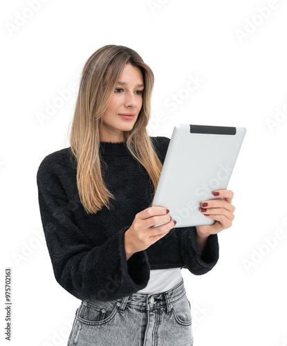 Woman in casual clothing holding a tablet while reading. Isolated on a white background. Concept of technology, reading, and modern communication