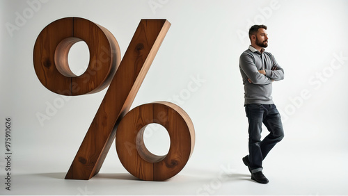 A thoughtful man with a beard leans against a giant wooden percentage symbol, suggesting reflection on finance or mathematics, isolated against a clean white background.