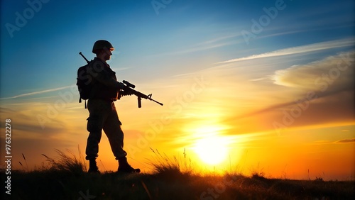 Soldier Silhouetted Against Sunset Holding Rifle in Field