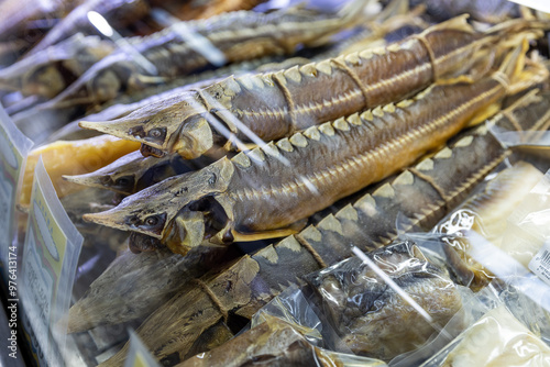 Russia. Astrakhan. Smoked sterlet in the window of the fish market.