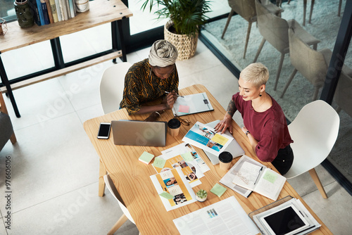 Office, above and people with technology in discussion for project research, report and teamwork. Journalist, ideas and meeting with documents at desk for magazine article, publishing and feedback