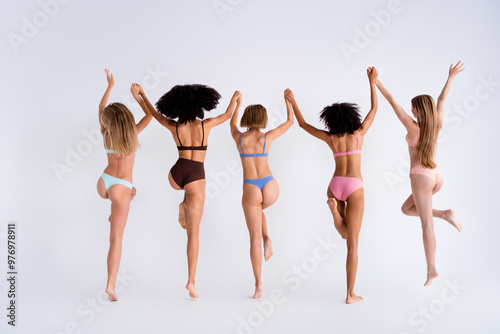 Full body rear portrait of lovely tender five model girls hold arms be yourself isolated on studio background