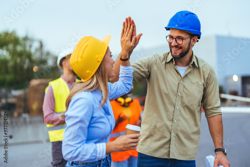 Construction Workers Celebrating Success With High Five