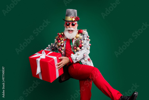 Photo of extravagant pensioner christmas gift cylinder hat decorated outfit isolated on dark green color background