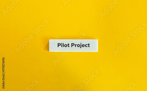 Pilot Project Banner. Text on Block Letter Tile on Yellow Background. Minimal Aesthetic.