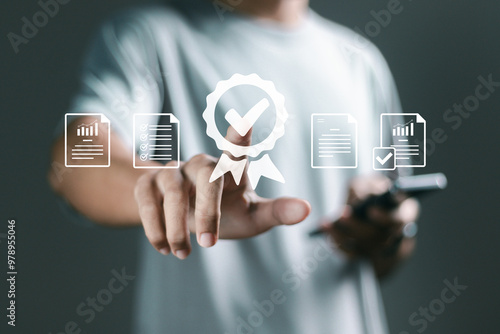 Quality control and quality guarantee process concept, Person touching certificate icon on virtual screen for approve quality assurance and guarantee business. business standard certificate