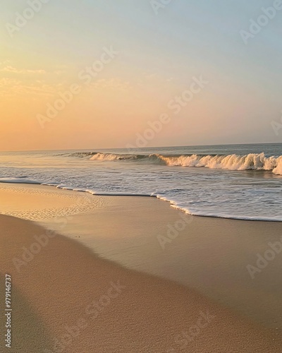 A serene beach scene at sunrise with gentle waves lapping at the shore, casting a golden glow across the sand.