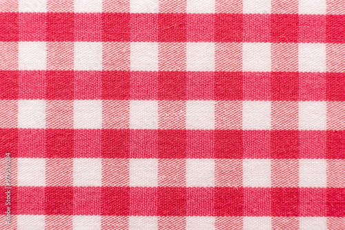 The texture of linen fabric in a large cage of pink and white. Scottish tailoring material. Checkered fabric