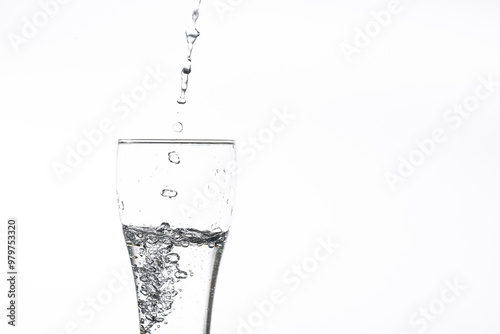 Pouring water into a glass on a white background. Close-up image,Glass of drinking water isolated on white background 