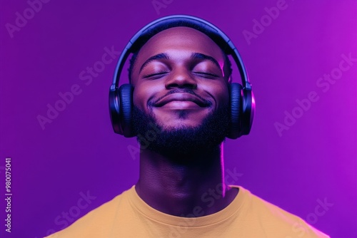 Music streaming platforms Image of a happy Black man in wireless headphones immersed in his favorite playlist eyes closed under neon lights against a purple backdrop panoramic vi