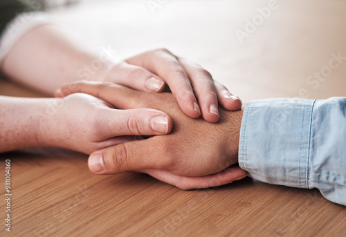 Love, support and people holding hands on table for marriage, kindness and understanding at home. Couple, trust and connection with compassion in commitment for partnership, forgiveness and comfort