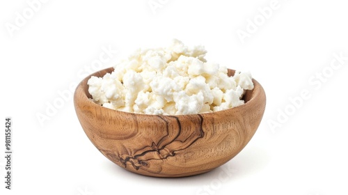 A wooden bowl filled with creamy cottage cheese against a clean white background