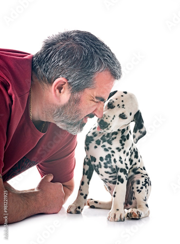 puppy dalmatian and man in studio