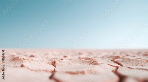 An arid scene showcasing dry, cracked earth under an expansive, clear sky. The desolate ground highlights the intense drought conditions of the environment.