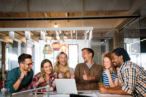 Startup business team on meeting in modern bright office interior and working together