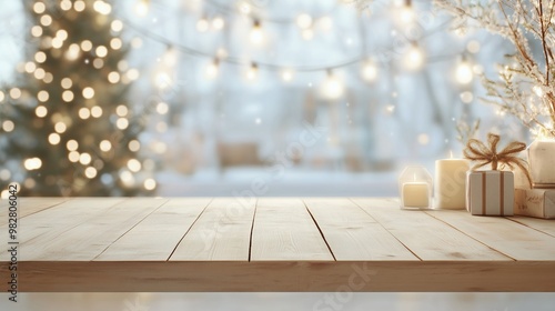 Empty wooden table with gift boxes, blurred background with Christmas tree and festive golden lights. Christmas and New Year concept. Winter holidays postcard, banner, background with copy space.