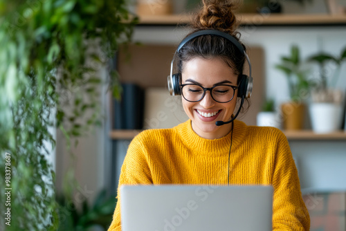 Smiling Woman in Headset Working on Laptop from Home