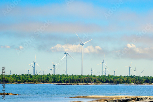 Green economy: wind turbines on Georgian Bay Ontario in summer room for text