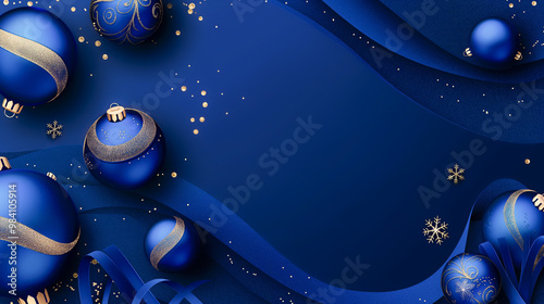 Christmas electric blue background. Christmas background with rich blue ornaments and gold glitter decorations on a royal blue background with copy space.