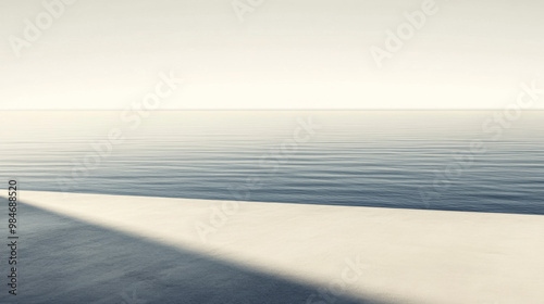 Calm waters reflecting soft light, capturing serene tranquility at dawn near a vast, smooth shoreline with gentle wave patterns