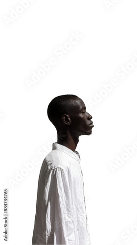 A profile portrait of a man in a white shirt, showcasing his calm and composed demeanor against a white background.