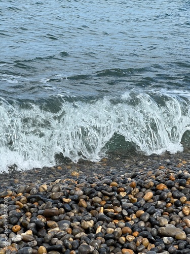 waves on the beach splashing the sand 