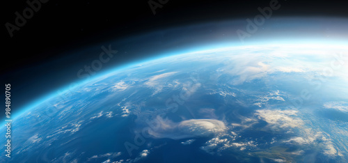 Realistic photo of Earth from space, showcasing the planet's blue atmosphere and cloud formations against the dark backdrop of space. Concept of planet Earth and space exploration