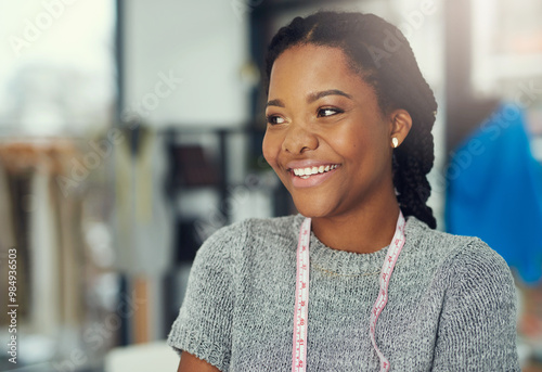 Small business, black woman and happy with tape for measuring, size accuracy or planning for design. Female person, fashion designer or thinking with tool for working, startup owner or laugh by space