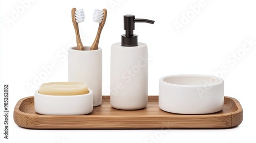 Elegant bathroom accessories set featuring a wooden tray, toothbrush holder, soap dispenser, and ceramic containers.