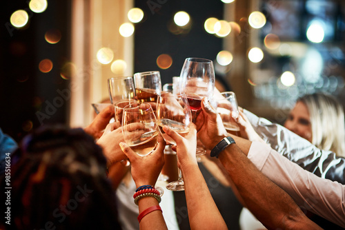 Cheers, alcohol and hands of people in club for party at night for celebration, birthday or fun. Group, drink and friends in crowd on dance floor with shot of whiskey for toast at disco event.